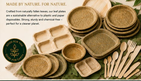 Eco-friendly disposable dishware made from fallen leaves, including plates, bowls, compartment trays, and wooden utensils arranged with green foliage.